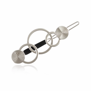 Detail of silver geometric triple-ring hair clip with spiral texture and matte black bar