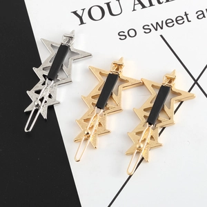 Polished star metal hair clips in gold and silver finish with hollow design