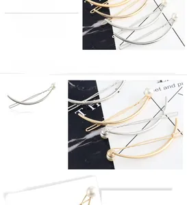 Detailed view of curved gold and silver hair clips with pearls and premium plating