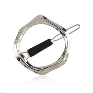 Silver irregular geometric metal hair clip with polished hammered texture on white background