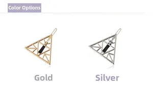 Detail view of hollow triangle hair clips in metallic gold and silver finishes