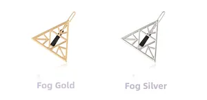 Close-up of geometric hollow triangle hair clips in matte gold and silver finishes