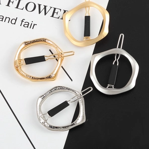 Irregular geometric circular hair clips in assorted gold and silver metal finishes