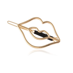 Minimalist gold lip-shaped cutout hair clip with polished metal finish on white background