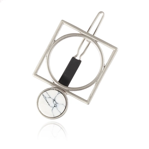Minimalist silver geometric hair clip with turquoise stone on white background
