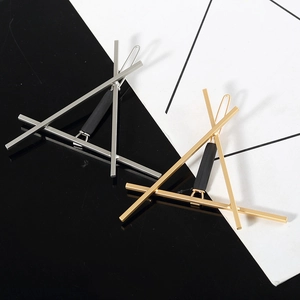 Minimalist geometric triangle hair clips in gold and silver finish for modern women