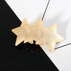 Matte gold triple star hair clip with textured sandblasted finish for daily styling