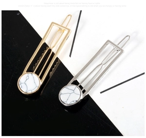 Minimalist geometric hollow hair clip set in gold and silver with marble pattern detail