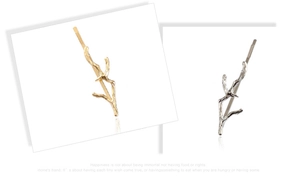 Détails des barrettes à cheveux dorées et argentées en forme de branche sur fond blanc