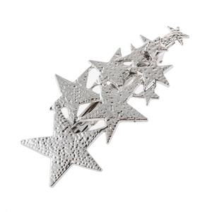 Macro view of textured silver metal hair clip with a layered five-pointed star design