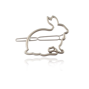 Minimalist hollow metal rabbit hair clip with a matte silver finish on white background