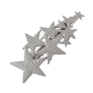 Detailed view of silver star hair clip with textured matte finish and snap closure