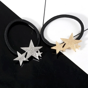 Elastic hair ties set with textured gold and silver triple star metal ornaments
