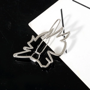 Irregular silver hair clip with anime character silhouette in a minimalist metal design