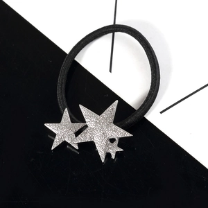 Elastic black hair tie featuring three shimmering silver textured stars of various sizes