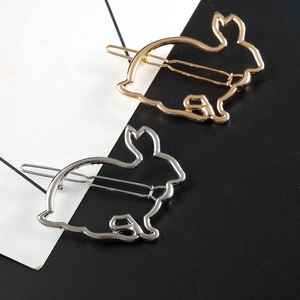 Detailed view of hollow rabbit-shaped hair clips in polished gold and silver metal finishes
