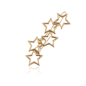 Elegante gouden haarklem met vijf overlappende sterren op een witte achtergrond