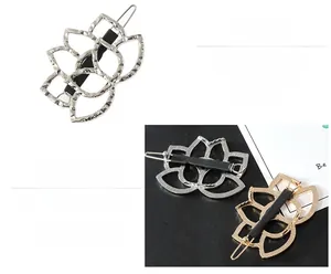 Detailed close-up of hollowed-out lotus hair clips in silver and gold alloy finish