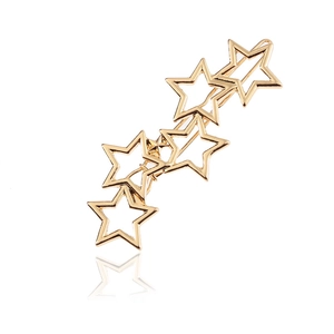 Minimalist golden hollow star hair clip in polished alloy metal finish on white back