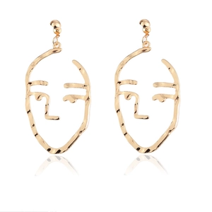 Artistic hollow gold face earrings with abstract metal lines and polished finish