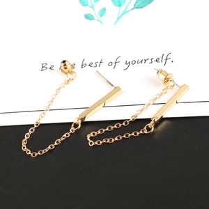 Minimalist gold long chain drop earrings with rectangular bar pendants on a display card