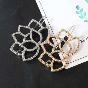 Hollow lotus flower metal hair clips with hammered texture in gold and silver finish