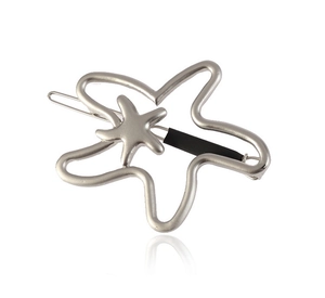 Detailed view of silver starfish hair clip with layered hollow and solid metal design