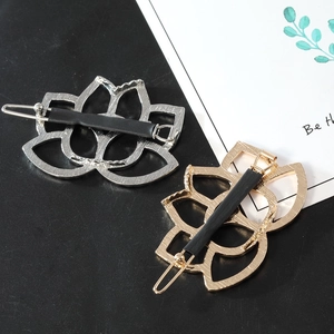 Hollow lotus flower alloy hair clips in gold and silver finish with non-slip spring grips