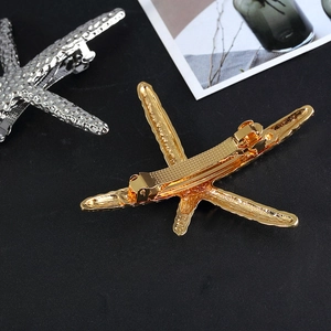 Fashionable gold and silver starfish metal hair clips with realistic textured surface