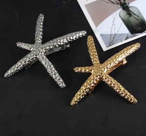 Chic gold and silver starfish hair clips set with textured bionic metal surface