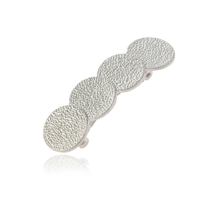 Barrette en alliage doré mat avec quatre disques ronds et texture martelée élégante