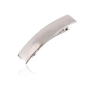 Detailed view of rectangular silver metal barrette with a high-polished mirror finish