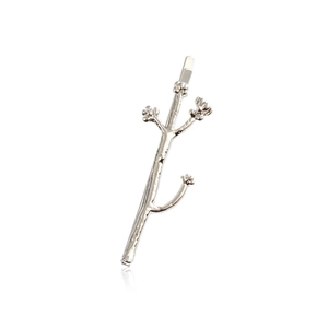 Minimalist silver branch hair clip with small flowers on a white background