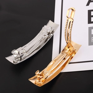 Minimalist rectangular metal spring hair clips in polished gold and silver finishes