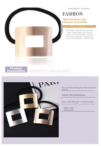 Close-up of minimalist hair tie featuring rectangular hollow brushed metal accent