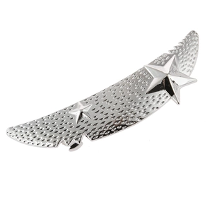 Detailed macro view of silver feather hair clip with textured surface and star accents