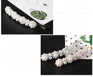 Detail of white faux pearls on an alloy hair clip showing elegant texture and craftsmanship