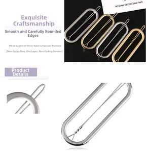 Macro detail of oval hollow hair clips with triple-layer gold plating on black surface