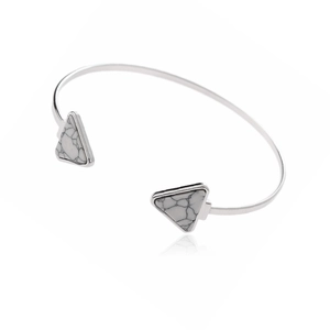 Silver open cuff bracelet with two marble triangular stones in a modern minimalist style