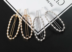 Set di quattro fermagli per capelli ovali in oro e argento con perle finte lucide