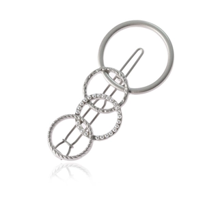 Silver hair clip with four interlocking circles featuring faux pearls and textured metal