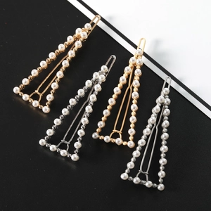 Set of four triangular metal hair clips with pearl borders in gold and silver finish