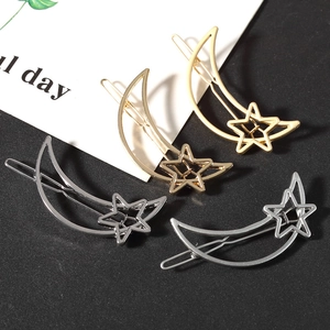 Set of 4 gold and silver hollow moon and star hair clips with polished metallic finish