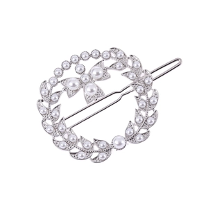 Silver vintage leaf wreath hair clip with white pearls and rhinestones on a white backdrop