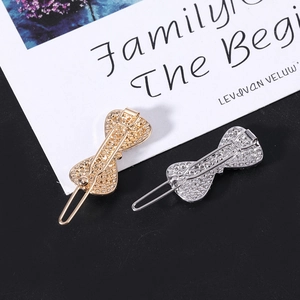 Fermagli per capelli a fiocco in oro e argento con trama diamantata e clip sul retro