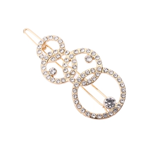 Eleganter goldener Haarclip mit überlappenden Ringen und funkelndem Strassbesatz