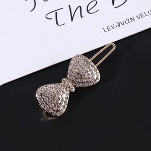 Fermaglio per capelli classico a fiocco dorato con strass scintillanti per uno stile elegante