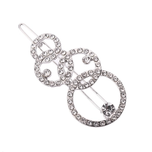 Silberne Haarspange mit überlappenden Ringen, Strasssteinen und geometrischem Design