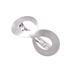 Silver infinity shape metal hair claw with a brushed finish on a white background