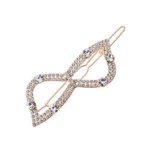 Elegant gold bow hair clip with hollow infinity design and sparkling faux crystals